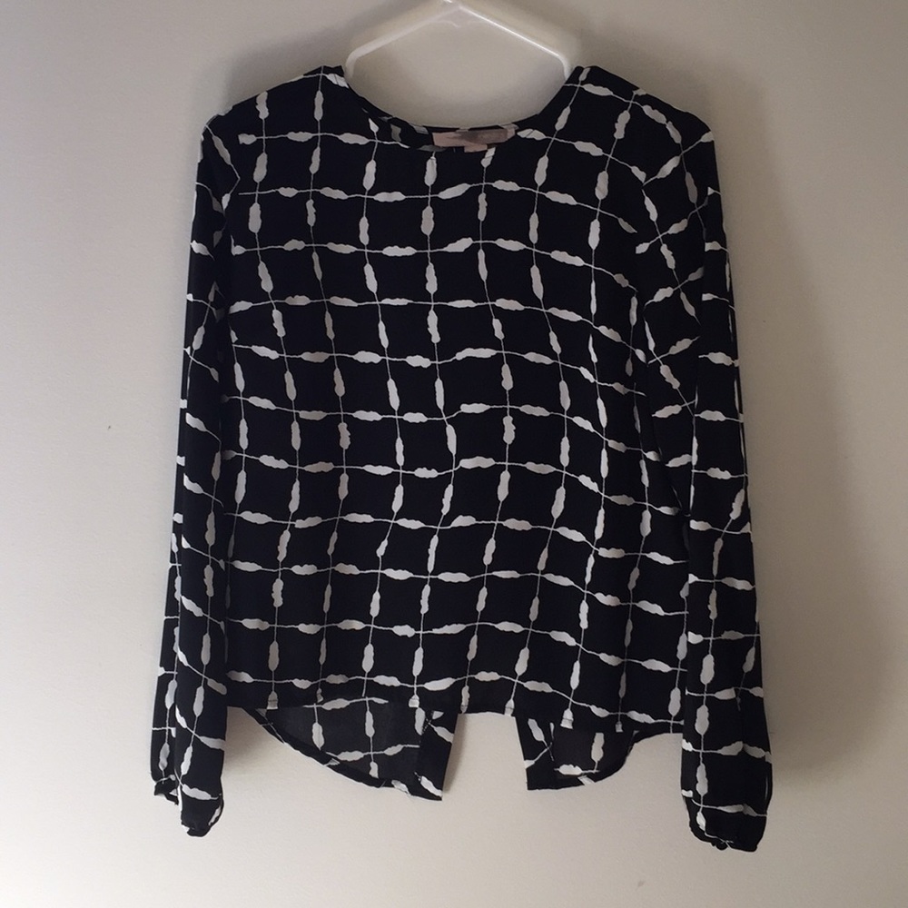 Black and white split open back blouse